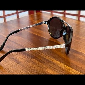 Black sunglasses with Aurora Borealis